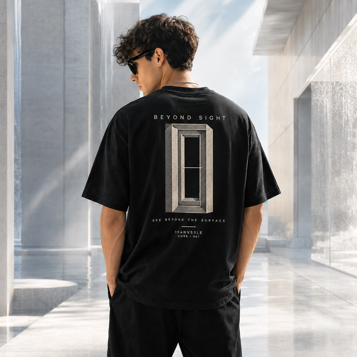 theNVSBLE CORE 001 Beyond Sight black T-shirt, back view with nested architectural frames