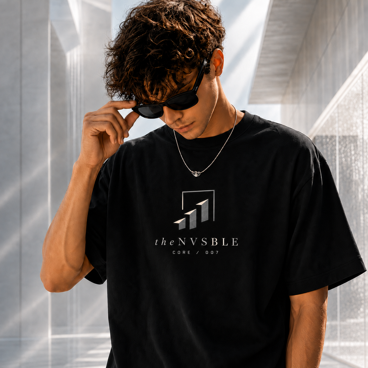 theNVSBLE CORE 007 WHERE OTHERS STOP black T-shirt, front view with new geometric emblem