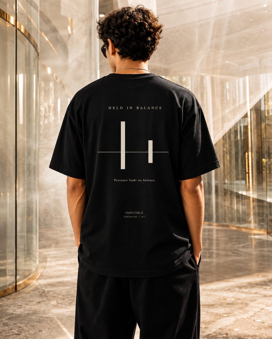 ESSENTIAL 011 — HELD IN BALANCE — back view